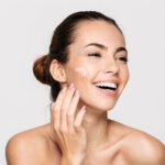 Close up beauty portrait of a laughing half naked woman